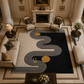 A large area rug with a bold black and cream wavy geometric pattern and two gold circular accents, styled in a grand, classical living room with columns, armchairs, and a fireplace.