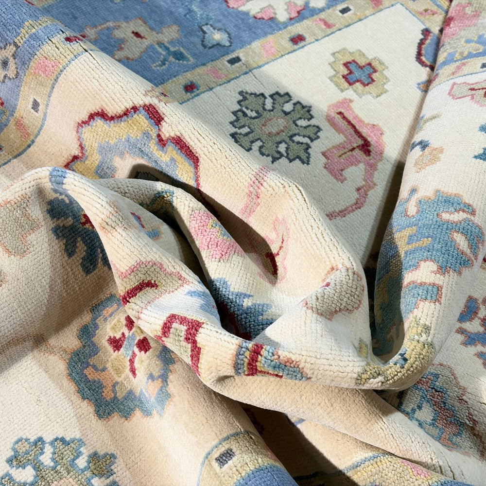 Close-up of a patterned rug with intricate designs in various colors.