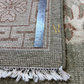 Rug with a ruler for scale showing its width