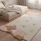 Children's room with a teddy bear rug on a wooden floor.