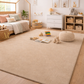 Children's room with a beige rug, toys, and furniture.