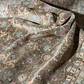Close-up of an intricately patterned rug with a focus on the texture and design.