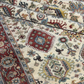 Close-up of a patterned rug with intricate designs.