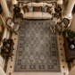 Decorative rug with intricate patterns in a room with furniture and decor.