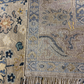 Close-up of a patterned rug with visible fringes