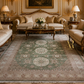 Luxurious living room with ornate furniture and a large patterned rug.