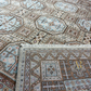Close-up of a patterned rug with geometric designs.