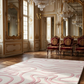 Luxurious room with ornate furniture, mirrors, and chandeliers.