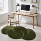 Modern home office with wooden desk, chairs, and green round rugs.