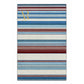 A rectangular area rug with horizontal stripes in shades of blue, cream, and burgundy, featuring a gold monogram logo in the top-left corner.