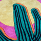 Colorful cactus design on a textured surface