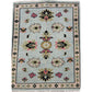 Decorative rug with floral patterns on a light blue background