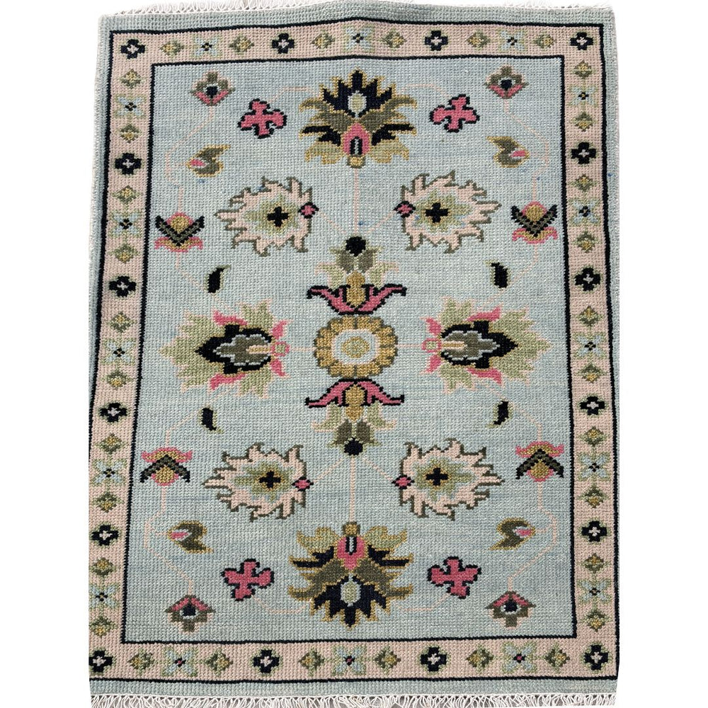 Decorative rug with floral patterns on a light blue background