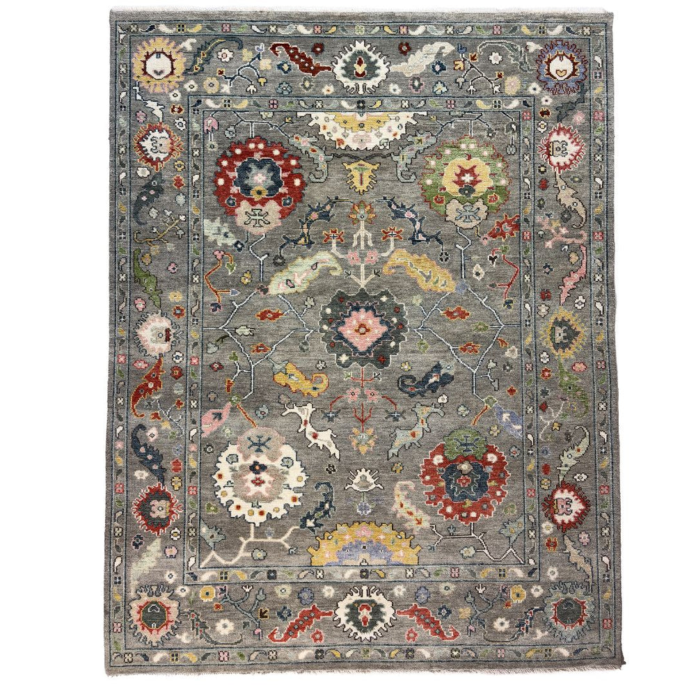 Decorative rug with floral and geometric patterns on a gray background
