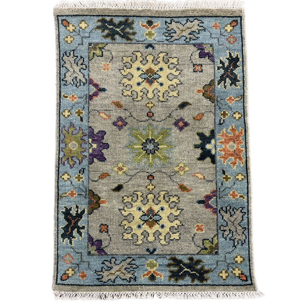 Decorative rug with intricate patterns on a white background