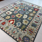 Decorative rug with colorful floral patterns on a tiled floor.
