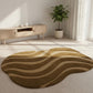 Wavy patterned rug on a light wooden floor with a plant and wooden cabinet in the background.