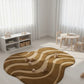 Wavy patterned rug on a light wooden floor with white curtains in the background