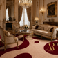 An ornate classical living room featuring a plush beige and burgundy patterned area rug with large organic shapes. The room is styled with antique-style gold-framed sofas, armchairs, a marble coffee table, a crystal chandelier, and classic wall decor.