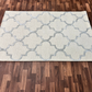 Patterned rug on a wooden floor