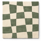 Checkered pattern with green and white squares on a white background