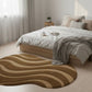 Bedroom with a wavy patterned rug on the floor