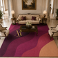 A large area rug with a wavy, abstract pattern in shades of magenta, purple, and peach, styled in a luxurious, symmetrical living room with a cream sofa, wooden coffee table, and classic lamps.