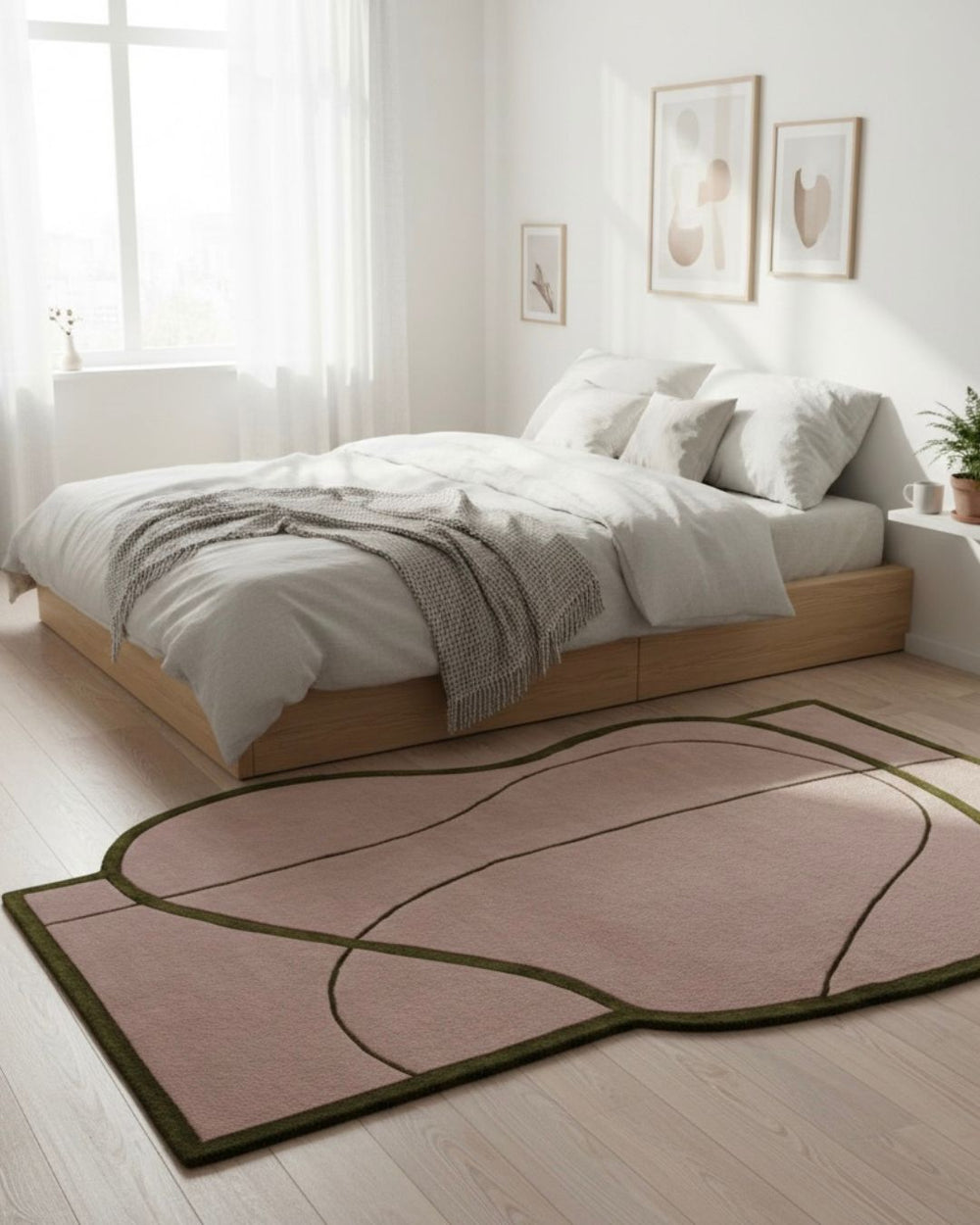 Modern bedroom with a pink rug on light wood flooring