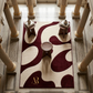 Patterned rug with a logo in a grand hall with columns