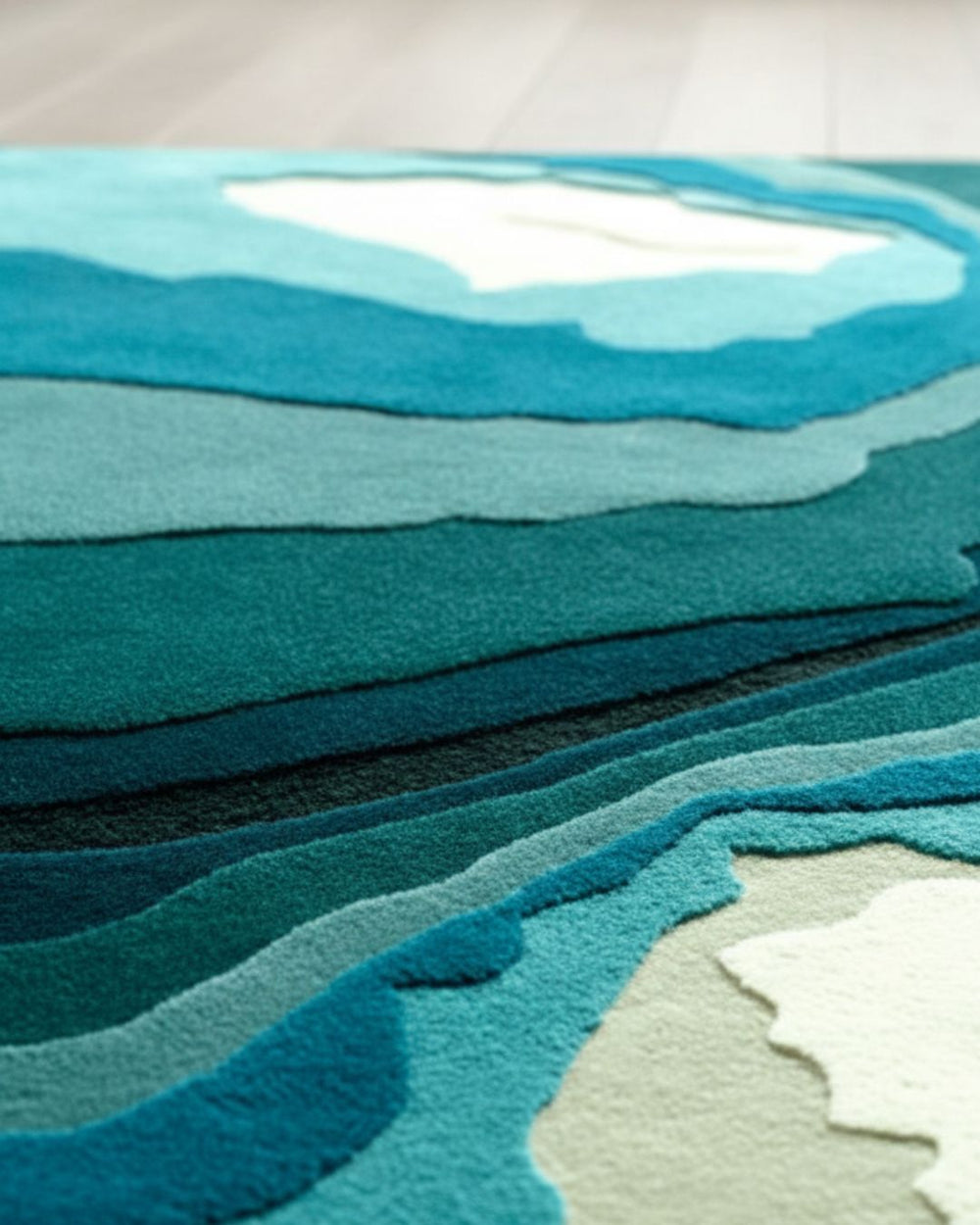 Textured fabric swatch with wavy pattern in teal and gray colors