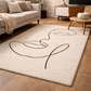 Beige rug with black abstract design in a living room setting