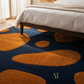 Bedroom with a blue and orange patterned rug