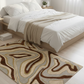 Bedroom with a patterned rug on the floor