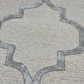 Close-up of a textured rug with geometric pattern