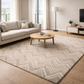 Living room with a patterned rug, sofa, and coffee table.