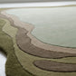 Round rug with concentric circle pattern on a white floor