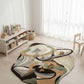 Modern rug with abstract design in a room with white curtains and wooden furniture.