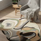Round area rug with abstract pattern in a living room setting