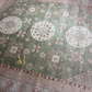 Close-up of a patterned rug with geometric and floral designs.