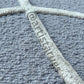 A close-up of a soft and textured rug with curved patterns