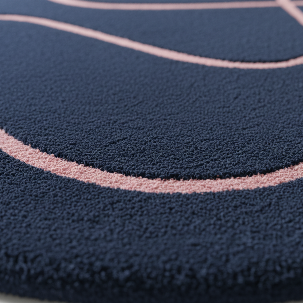 Close-up of a textured blue surface with pink circular patterns