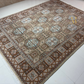 Decorative rug with geometric pattern on a white floor