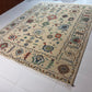 Decorative rug with intricate patterns on a tiled floor