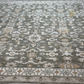 Close-up of a patterned rug with geometric and floral designs.