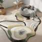Abstract patterned rug on a wooden floor with a gray pet bed and toys.