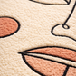 Close-up of a textured surface with abstract designs in pink, black, and white.
