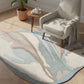 Round rug with wavy pattern in a living room setting with a chair and plant.