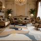 A luxury living room featuring a large abstract area rug with beige, navy, and cream waves, styled with classic wooden furniture, a crystal chandelier, and potted plants.