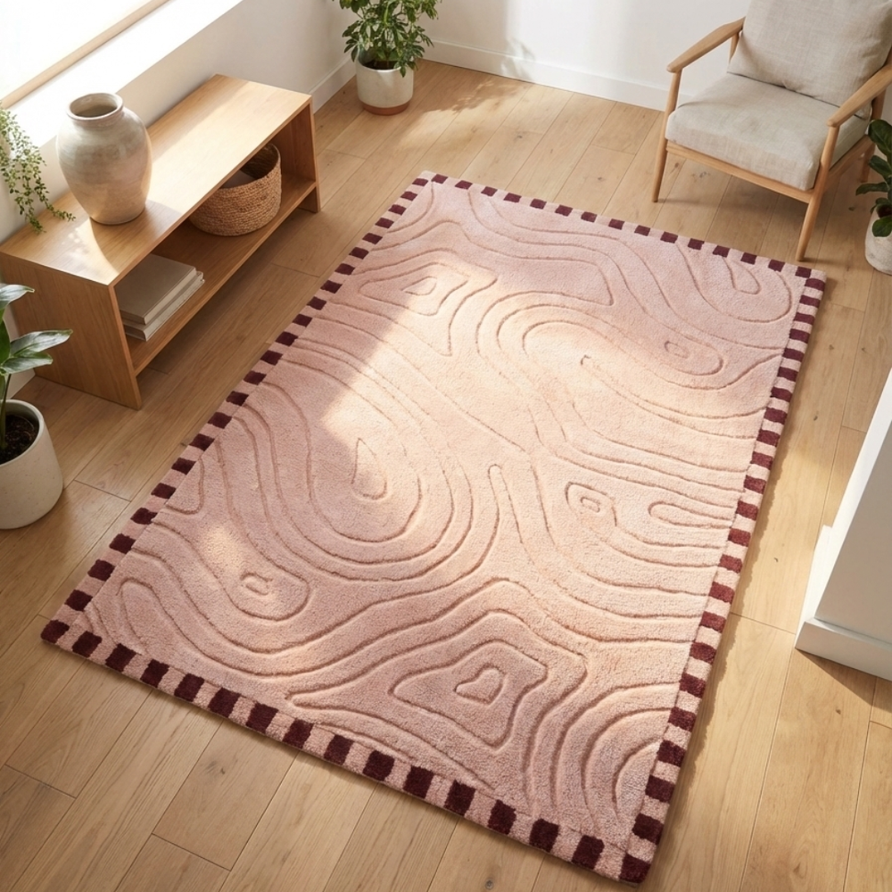 Decorative rug with wavy pattern on a wooden floor in a room with furniture and plants.