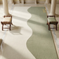 Wavy patterned rug in a room with classical architecture
